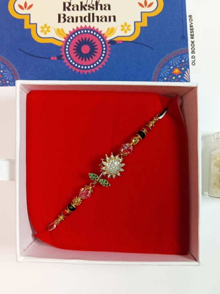 Spinning Flower Rakhi Gift Box: Premium Stone Daisy Designer Rakhi Set