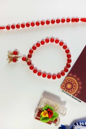 Lumba Rakhi Gift Box for Bhaiya Bhabhi: Red Beads & Pearl Crafted Rakhi Gift Set