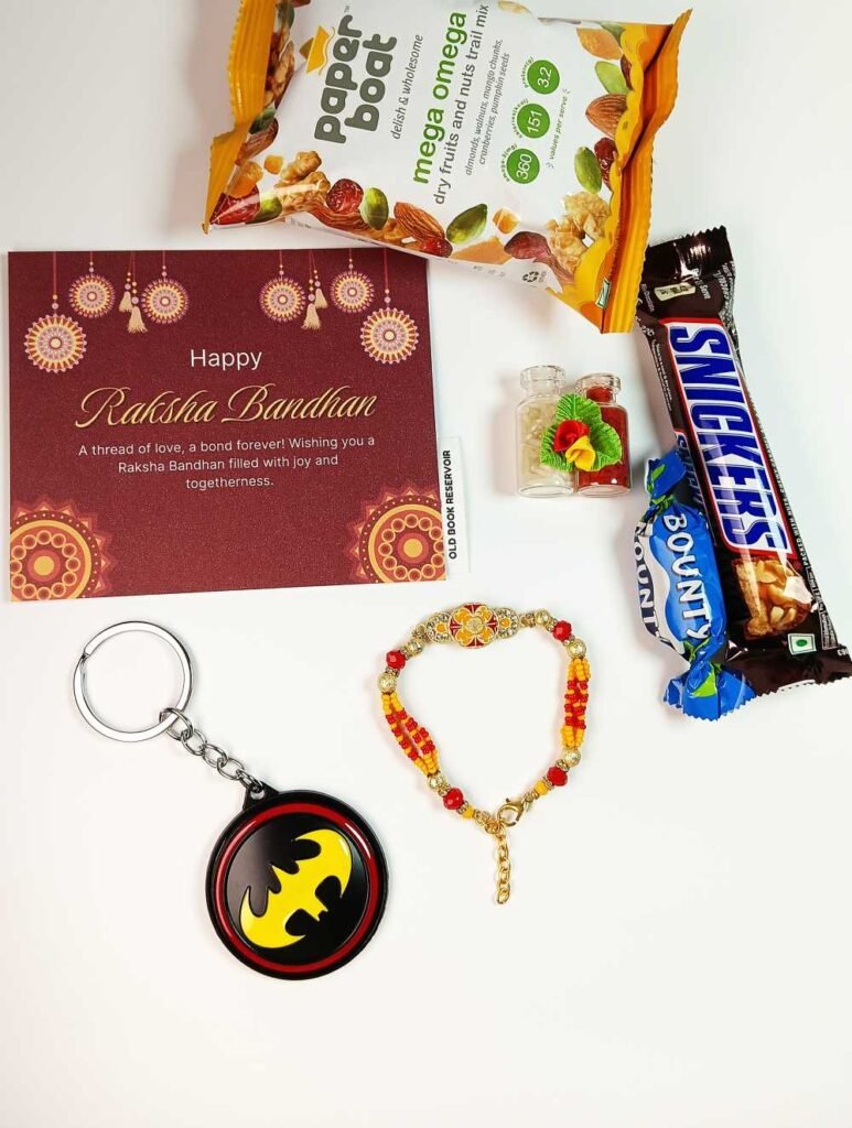 Yellow Rakhi Gift Box: Designer Rakhi and Batman Keychain Set