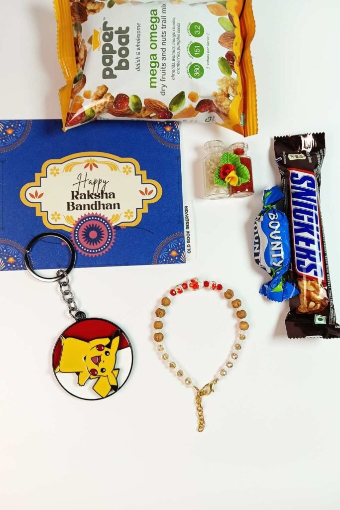 Wooden Rakhi Gift Box: Designer Ceramic Rakhi and Pikachu Keychain Set